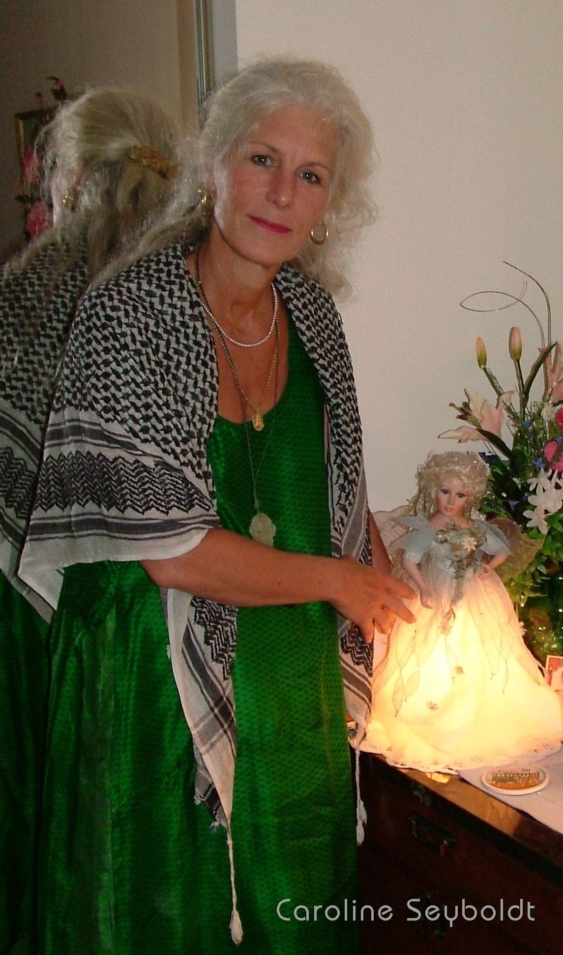 Energy Savings fluorescent Light Oil Natural Gas savings Economic Stimulus Recovery photograph of Colette Dowell with little light burning no LEDS