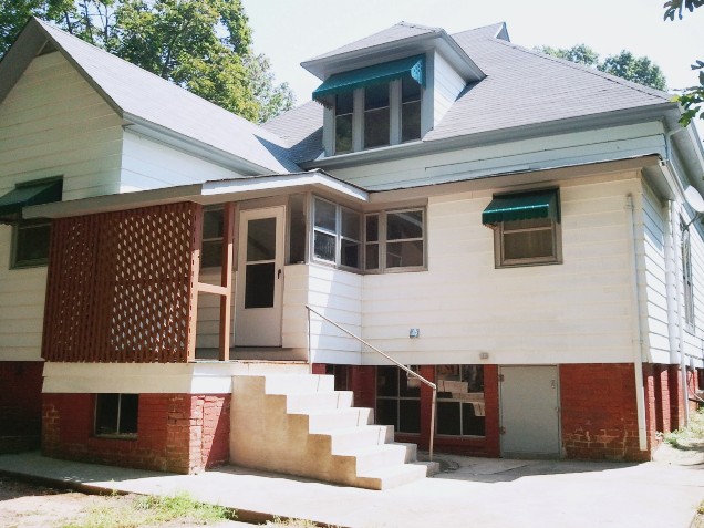 Historical Home landmark for sale brick foundation window antique window Colette Dowell